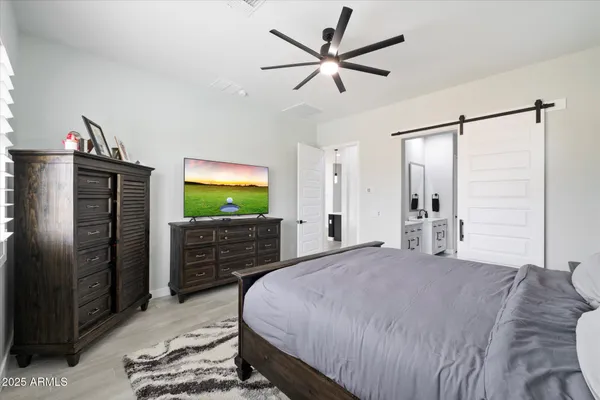 a bathroom with double vanity sink and a mirror