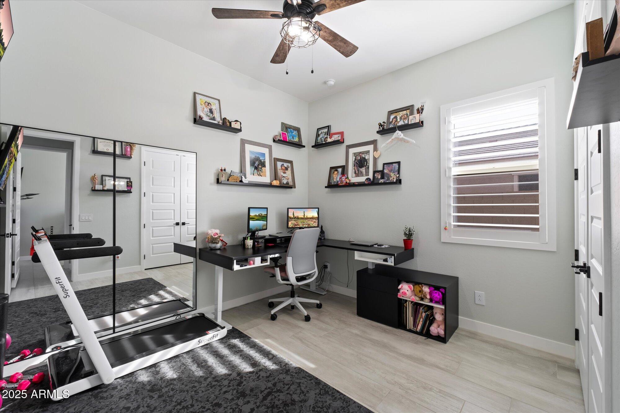 20954 East Camacho Road Queen Creek, AZ 85142 - Photo 19 of 35 a view of a workspace with furniture and a window