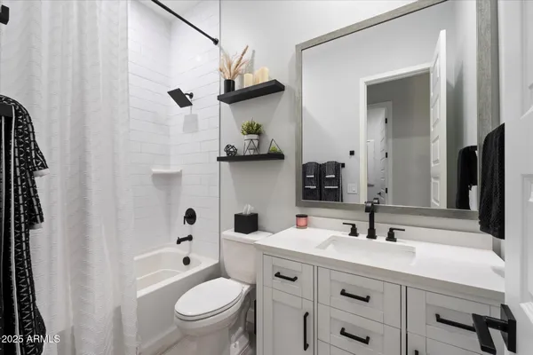 a view of a house with swimming pool and view of a lake