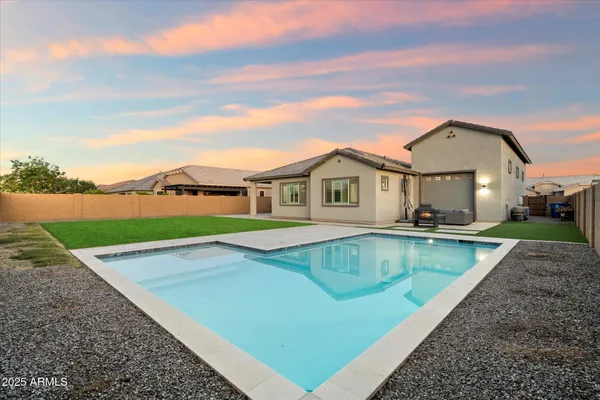 a view of house with yard entertaining space