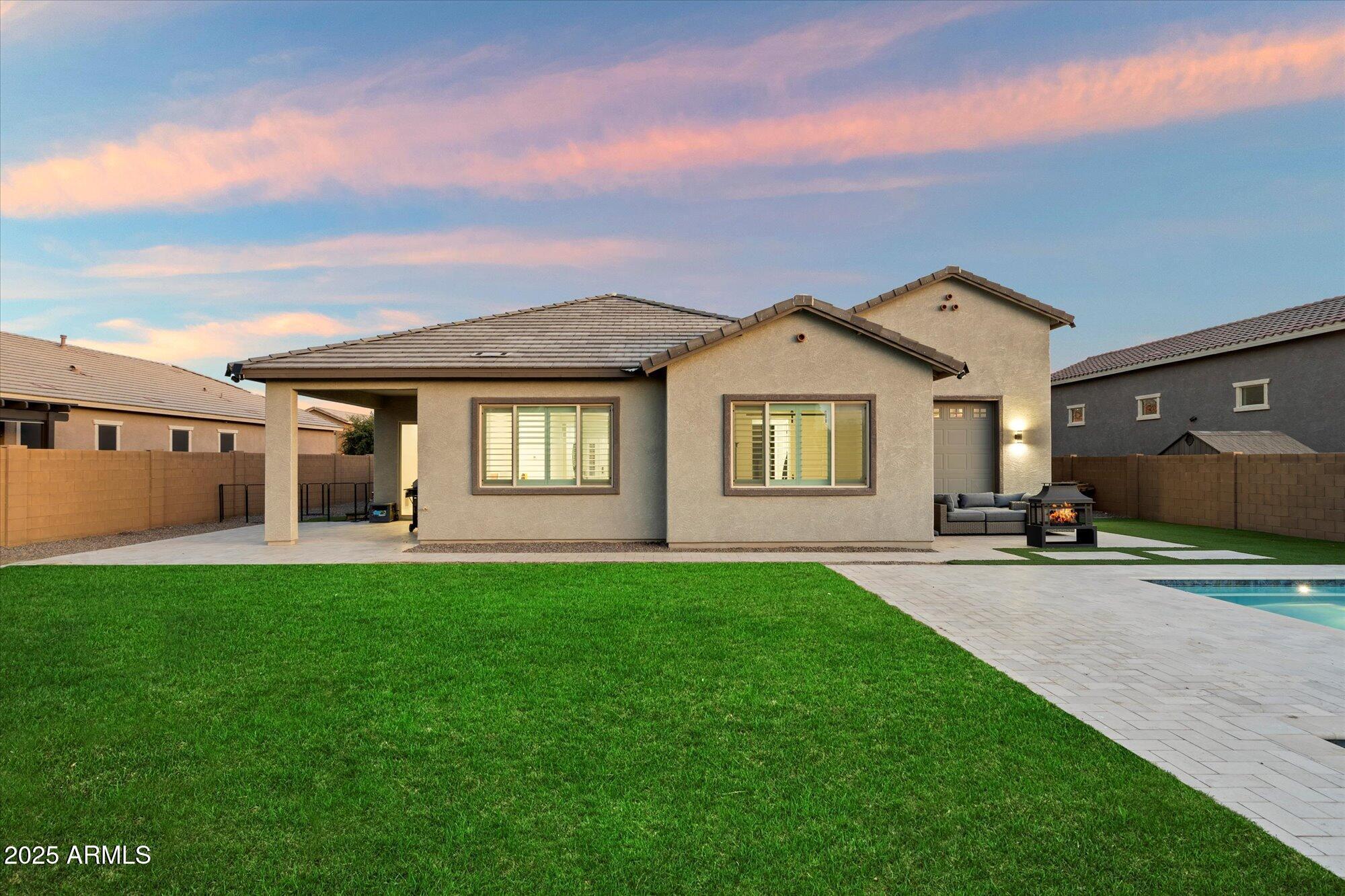 20954 East Camacho Road Queen Creek, AZ 85142 - Photo 28 of 35 a front view of a house with a garden and yard