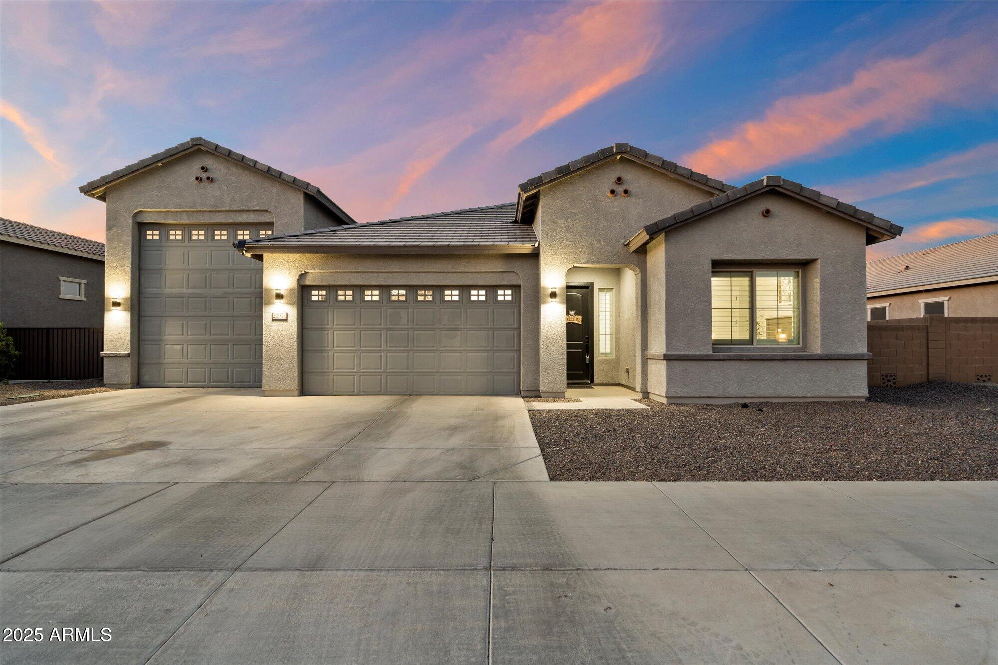 20954 East Camacho Road Queen Creek, AZ 85142 - Photo 35 of 35 a front view of a house with a yard and garage