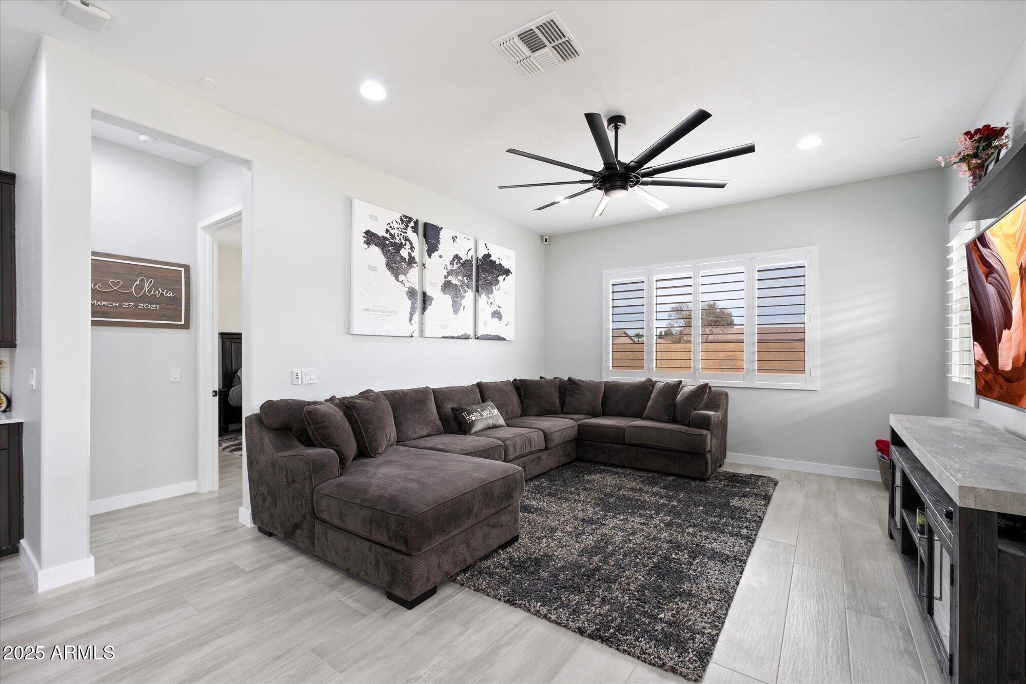 20954 East Camacho Road Queen Creek, AZ 85142 - Photo 9 of 35 a living room with furniture and a window