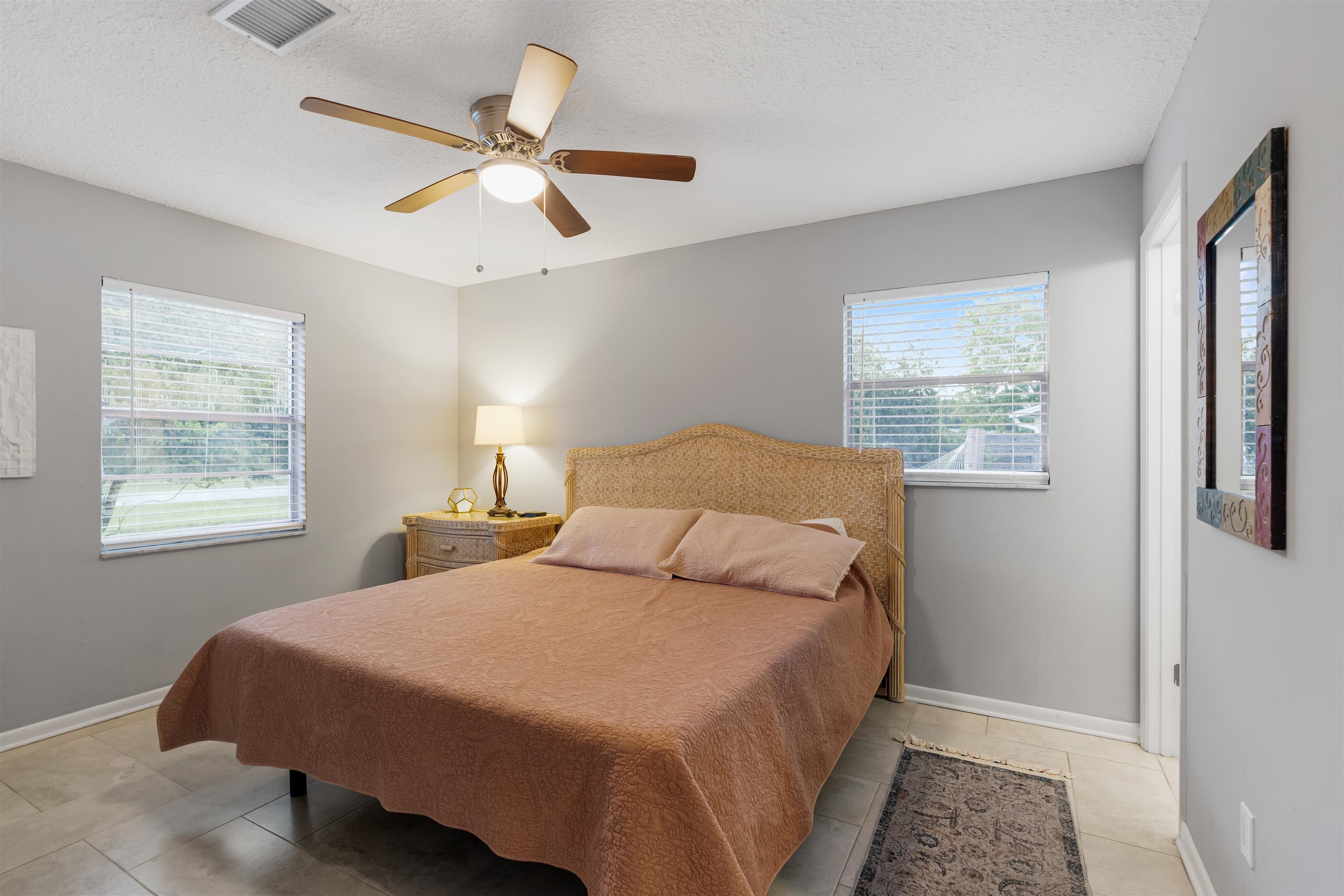 311 Deltona Boulevard St. Augustine, FL 32086 - Photo 11 of 16 a bedroom with a bed and window