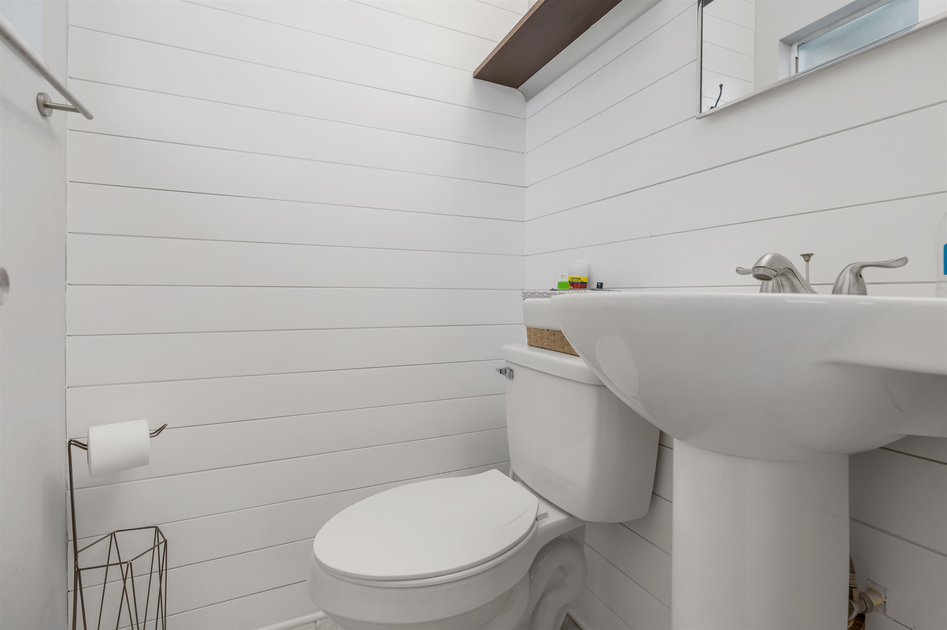 311 Deltona Boulevard St. Augustine, FL 32086 - Photo 13 of 16 a bathroom with a toilet a sink and mirror