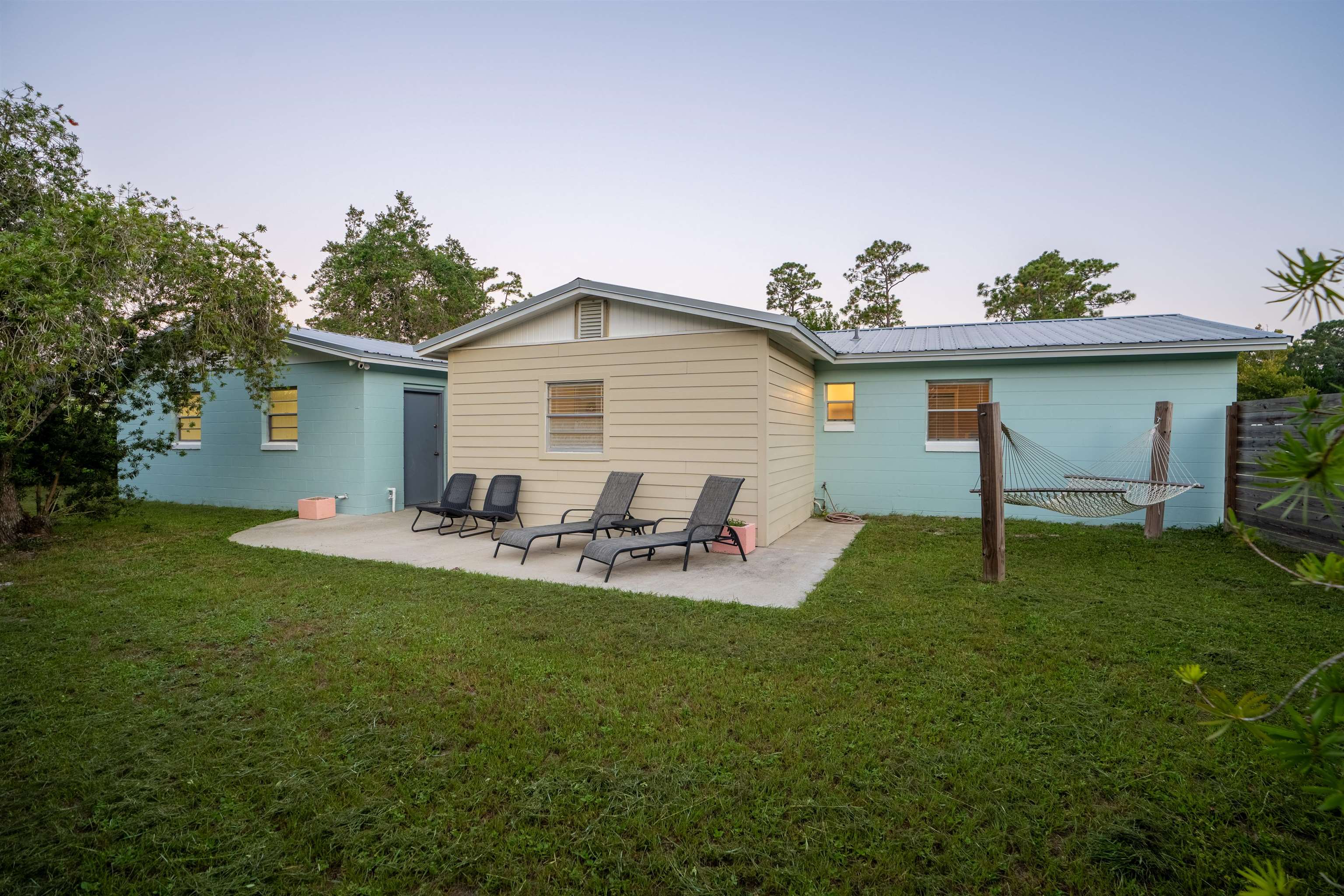 311 Deltona Boulevard St. Augustine, FL 32086 - Photo 14 of 16 a view of a house with a yard and sitting area