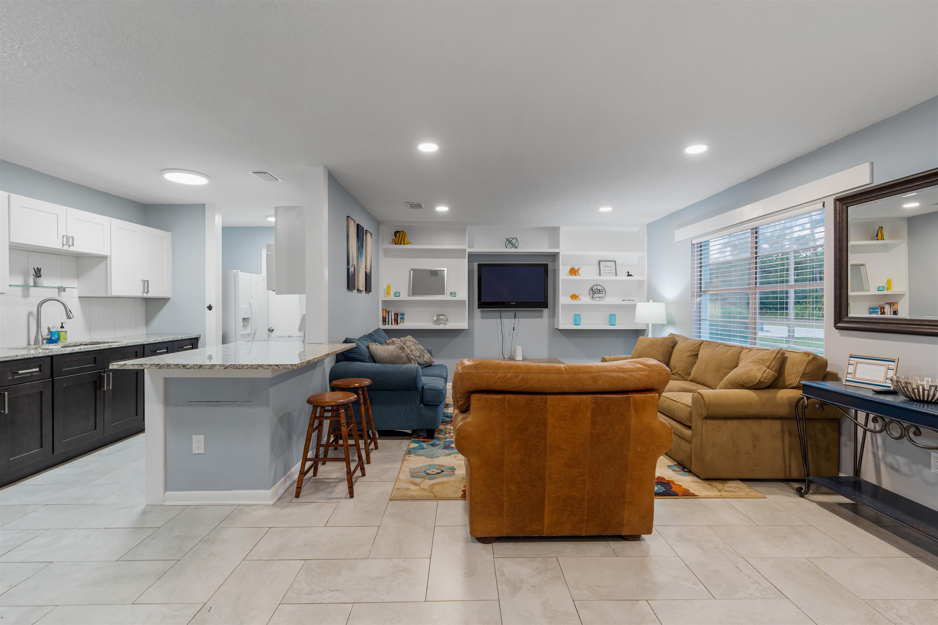 311 Deltona Boulevard St. Augustine, FL 32086 - Photo 4 of 16 a living room with furniture and a flat screen tv