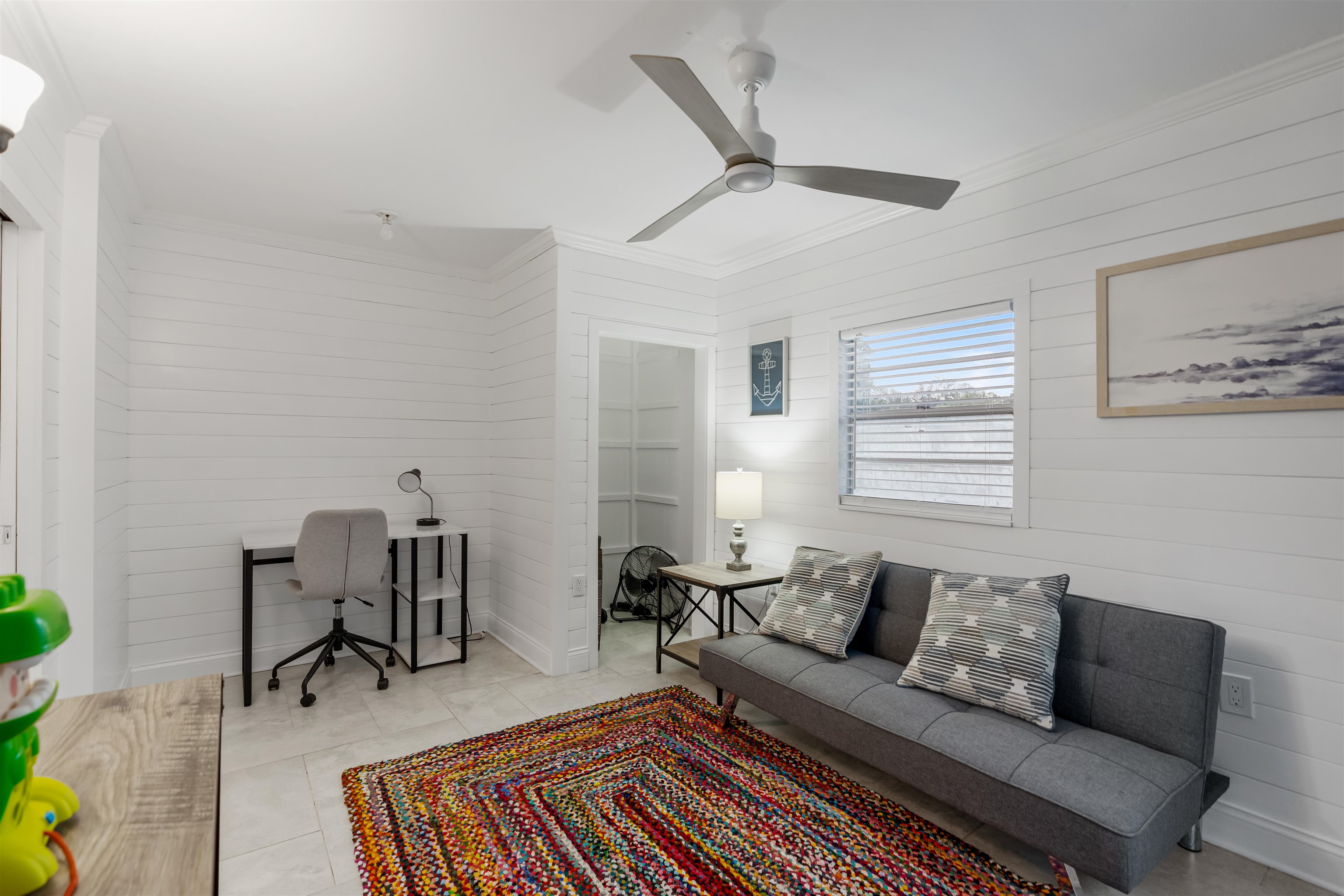 311 Deltona Boulevard St. Augustine, FL 32086 - Photo 8 of 16 a living room with furniture and a window