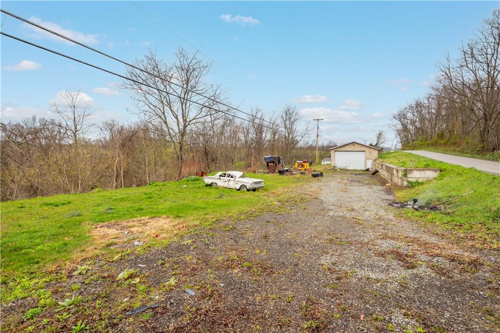 571 Highland Ridge Road Marianna, PA 15345 - Photo 19 of 25 a row yard with swimming pool and trees