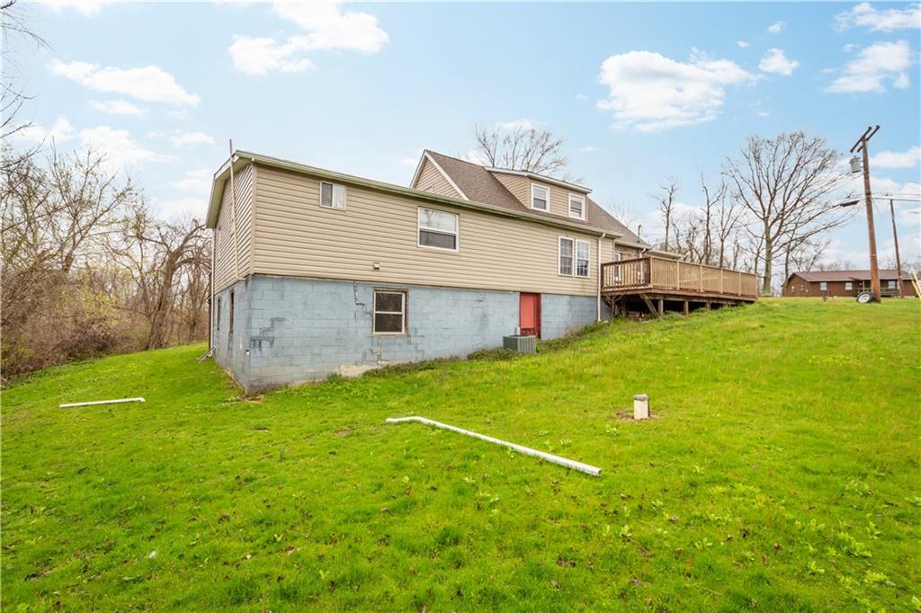 571 Highland Ridge Road Marianna, PA 15345 - Photo 22 of 25 a backyard of a house with table and chairs