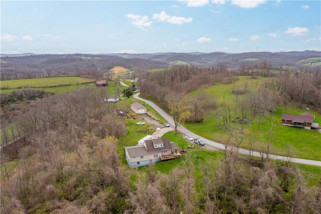 571 Highland Ridge Road Marianna, PA 15345 - Photo 24 of 25 a view of a house with a garden