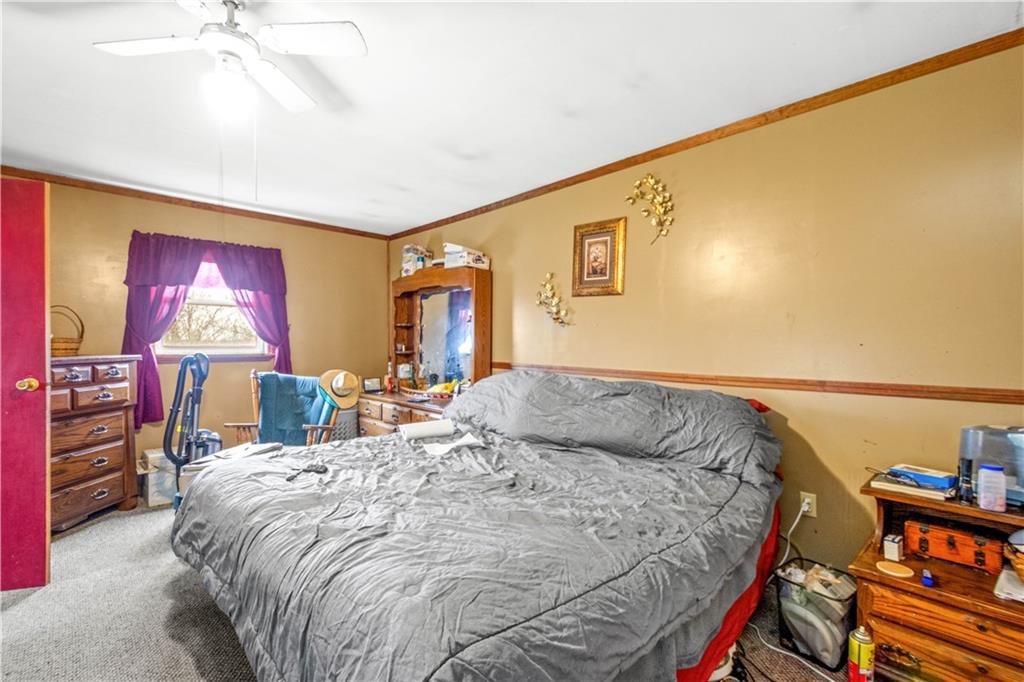 571 Highland Ridge Road Marianna, PA 15345 - Photo 10 of 25 a bedroom with a bed and a flat screen tv