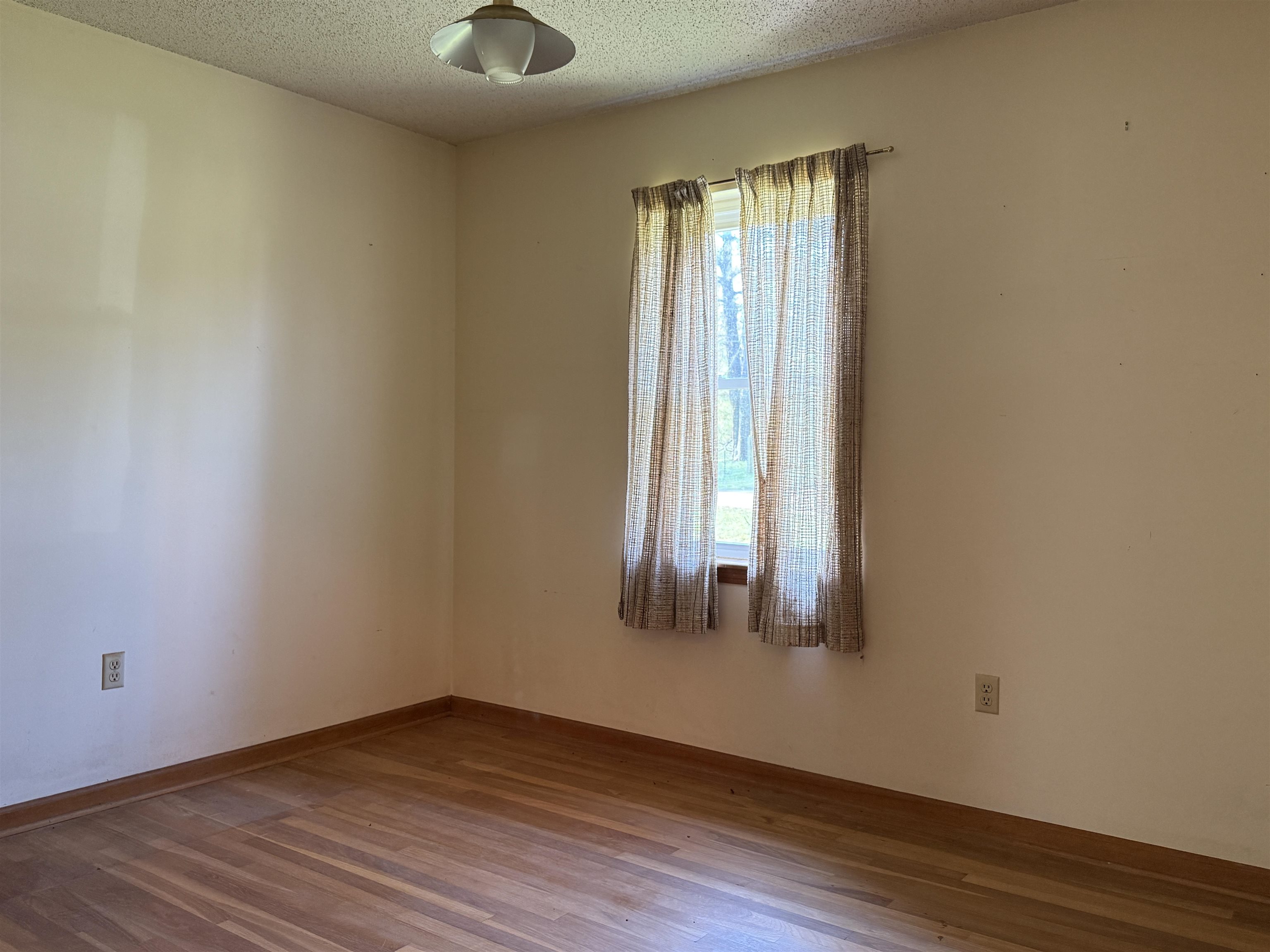 9640 New Bethel Road Millington, TN 38053 - Photo 16 of 22 an empty room with wooden floor and windows