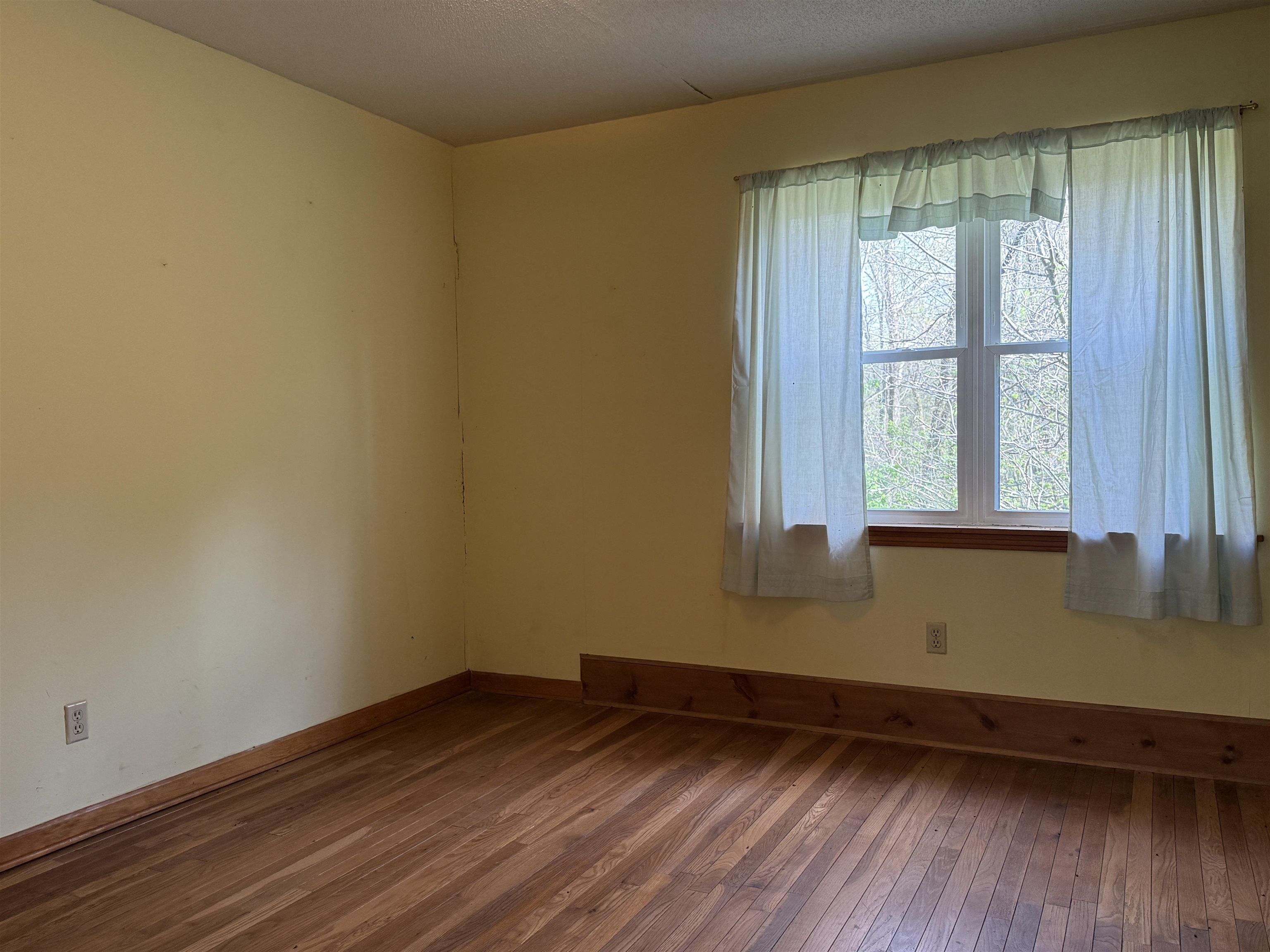 9640 New Bethel Road Millington, TN 38053 - Photo 19 of 22 an empty room with wooden floor and windows