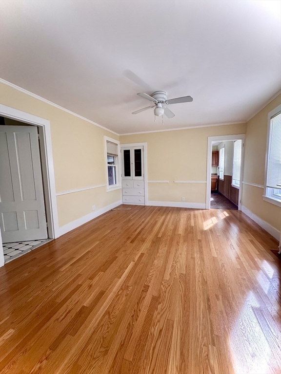 57 Adams Avenue Newton, MA 02465 - Photo 12 of 38 a view of an empty room with wooden floor and a window