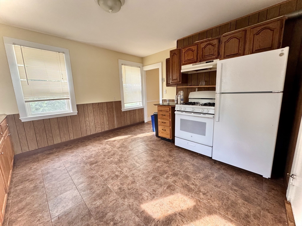 57 Adams Avenue Newton, MA 02465 - Photo 18 of 38 a kitchen with stainless steel appliances a refrigerator sink and microwave