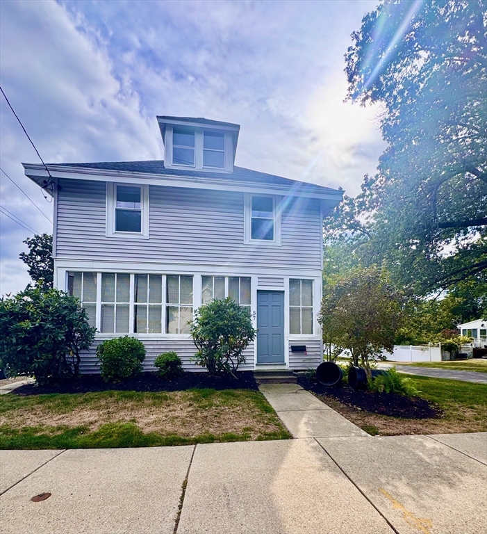 57 Adams Avenue Newton, MA 02465 - Photo 2 of 38 a front view of a house with garden
