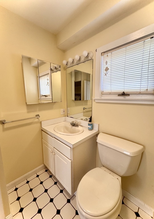 57 Adams Avenue Newton, MA 02465 - Photo 21 of 38 a bathroom with a sink toilet and mirror
