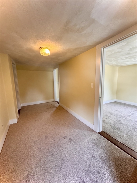 57 Adams Avenue Newton, MA 02465 - Photo 27 of 38 an empty room with a natural light