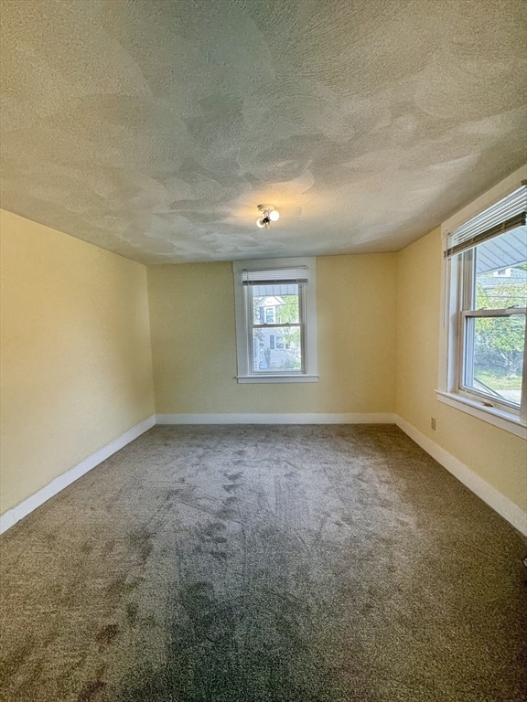 57 Adams Avenue Newton, MA 02465 - Photo 30 of 38 an empty room with a window