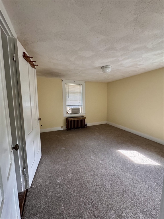 57 Adams Avenue Newton, MA 02465 - Photo 32 of 38 a view of empty room with a fireplace