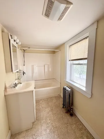 a bathroom with a toilet sink and bathtub