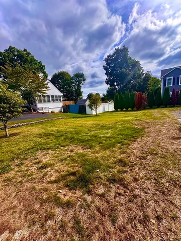 a house view with swimming pool