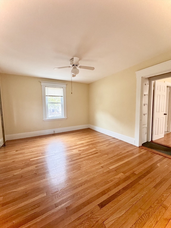 57 Adams Avenue Newton, MA 02465 - Photo 8 of 38 a view of an empty room with wooden floor and a window
