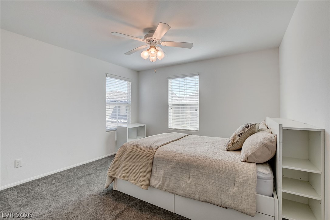 484 Filaree Place Henderson, NV 89015 - Photo 31 of 71 Bright and airy, this bedroom offers a tranquil retreat with ample natural light.
