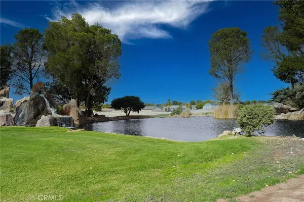 a swimming pool with outdoor seating and yard