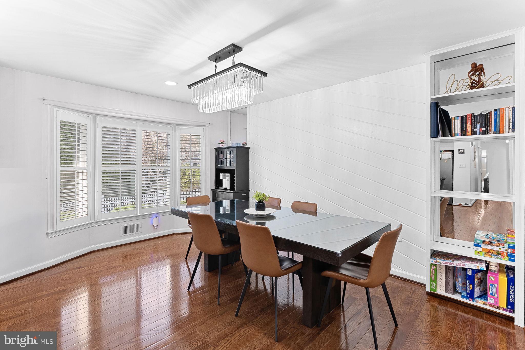 6208 Ormandy Drive Burke, VA 22015 - Photo 13 of 57 a view of a dining room with furniture window and wooden floor