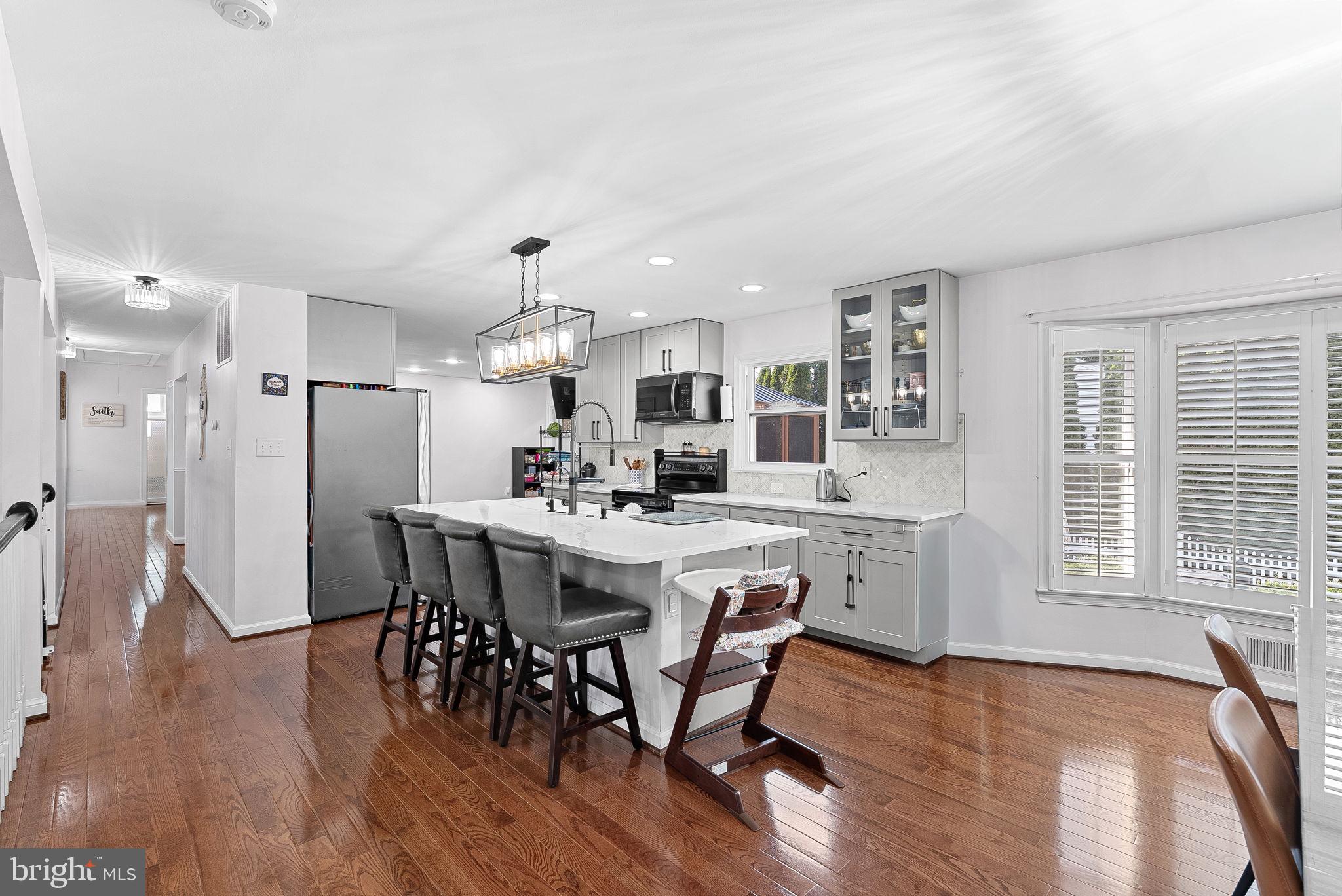 6208 Ormandy Drive Burke, VA 22015 - Photo 15 of 57 a view of a dining room with furniture window and wooden floor