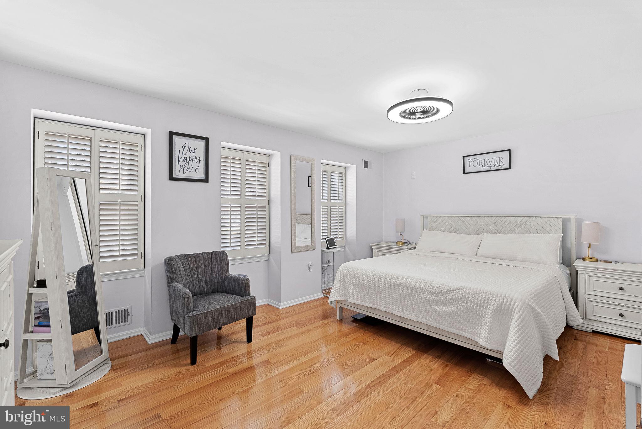 6208 Ormandy Drive Burke, VA 22015 - Photo 21 of 57 a bedroom with a bed and a chair