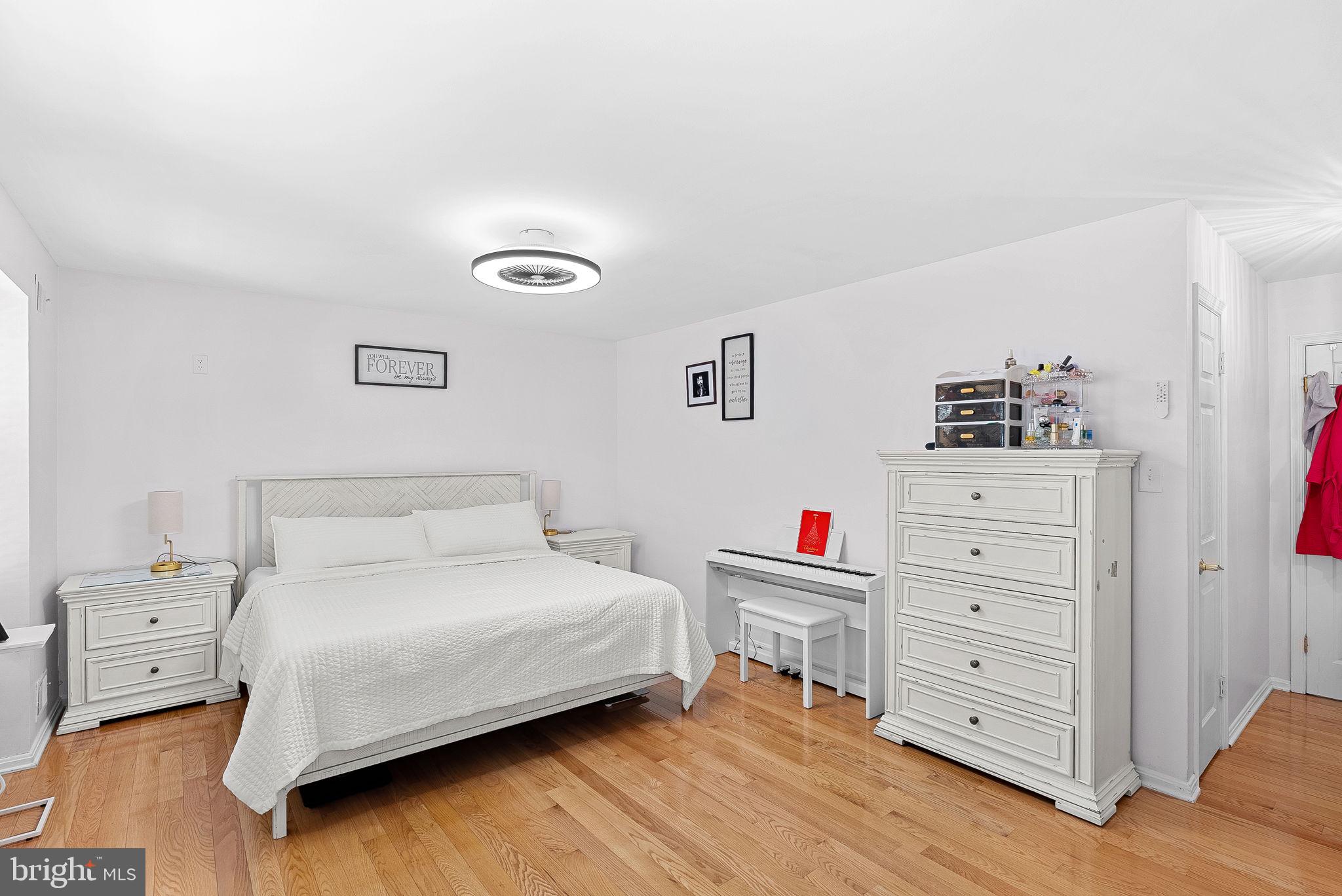 6208 Ormandy Drive Burke, VA 22015 - Photo 24 of 57 a bedroom with a bed and a cabinets