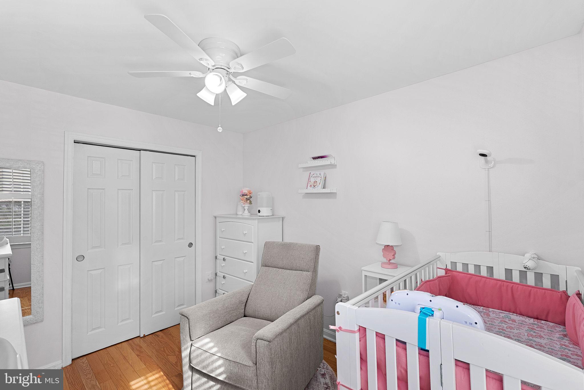 6208 Ormandy Drive Burke, VA 22015 - Photo 29 of 57 a living room with furniture and a chandelier