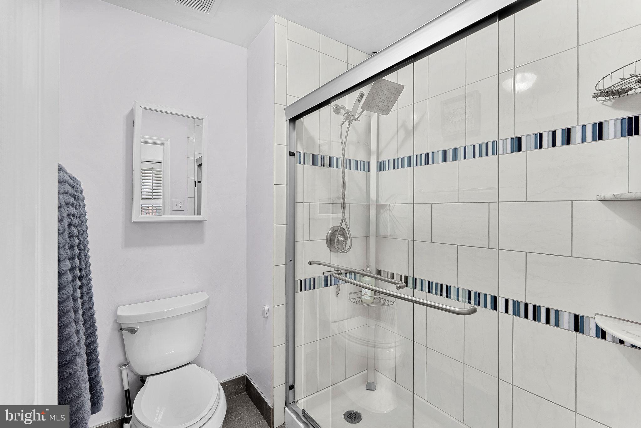 6208 Ormandy Drive Burke, VA 22015 - Photo 34 of 57 a bathroom with a toilet and a shower