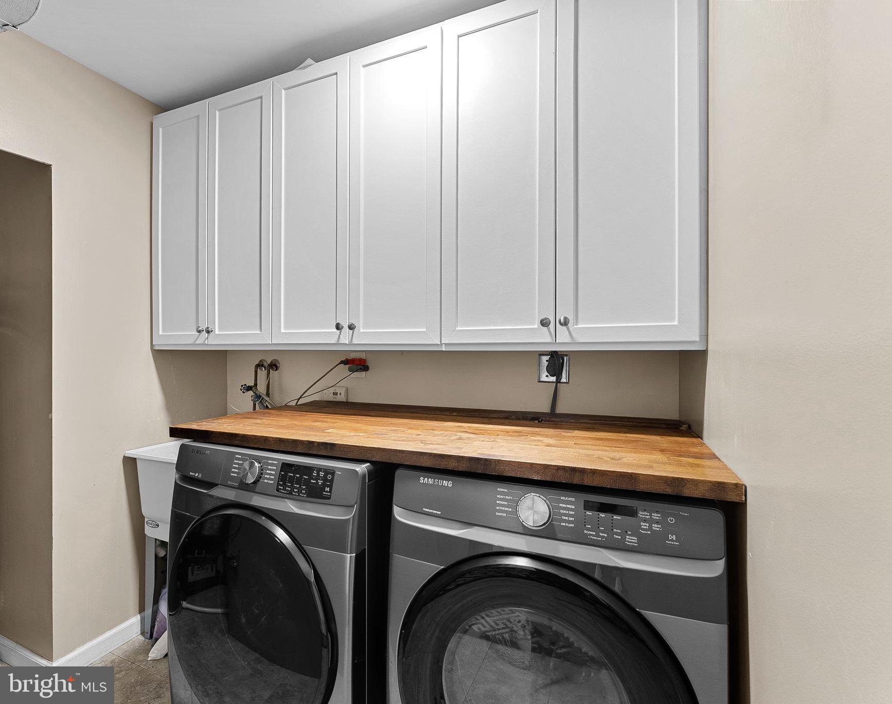 6208 Ormandy Drive Burke, VA 22015 - Photo 35 of 57 a utility room with dryer and washer