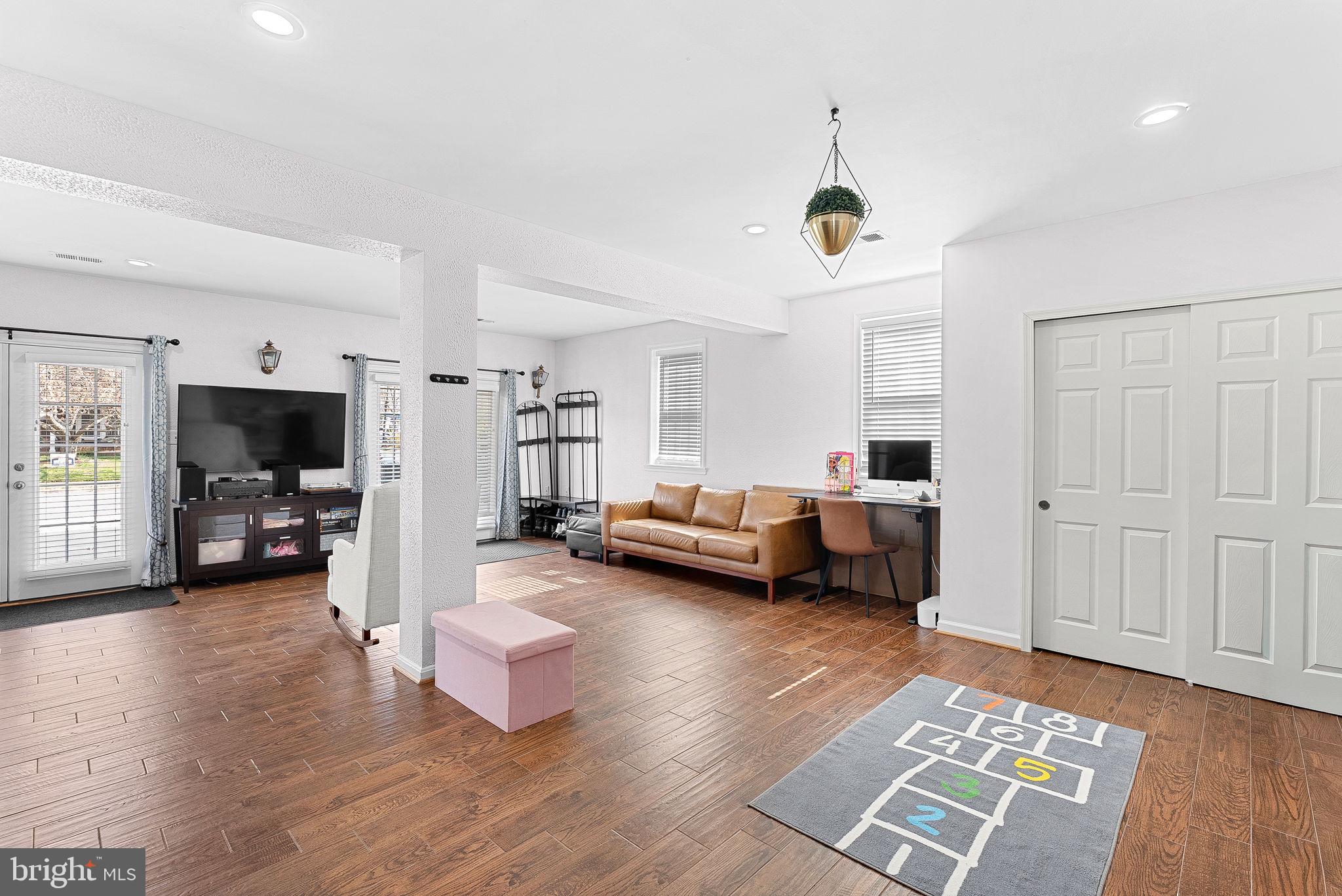 6208 Ormandy Drive Burke, VA 22015 - Photo 39 of 57 a view of a livingroom with furniture and a flat screen tv