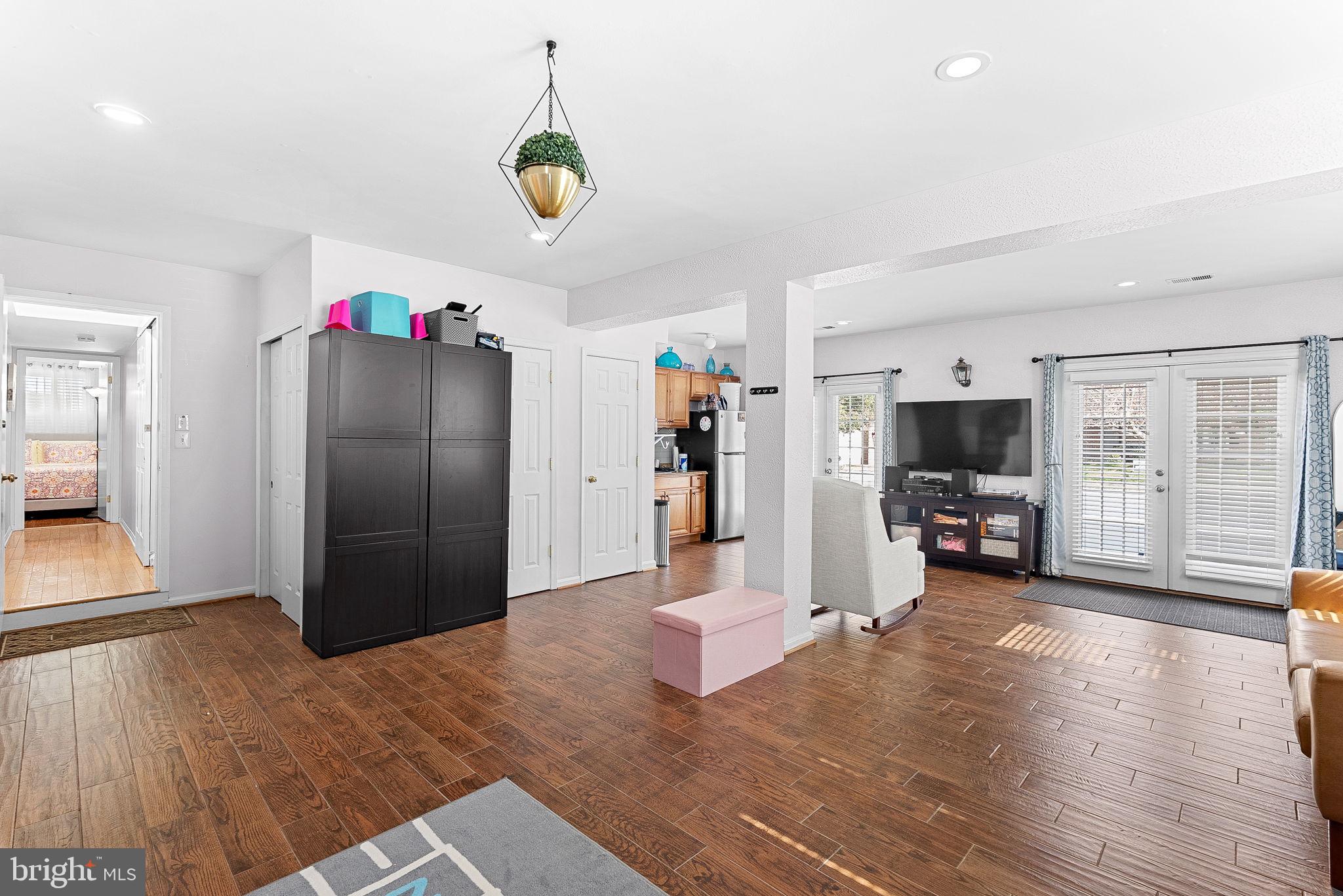 6208 Ormandy Drive Burke, VA 22015 - Photo 40 of 57 a view of a livingroom with furniture and a flat screen tv