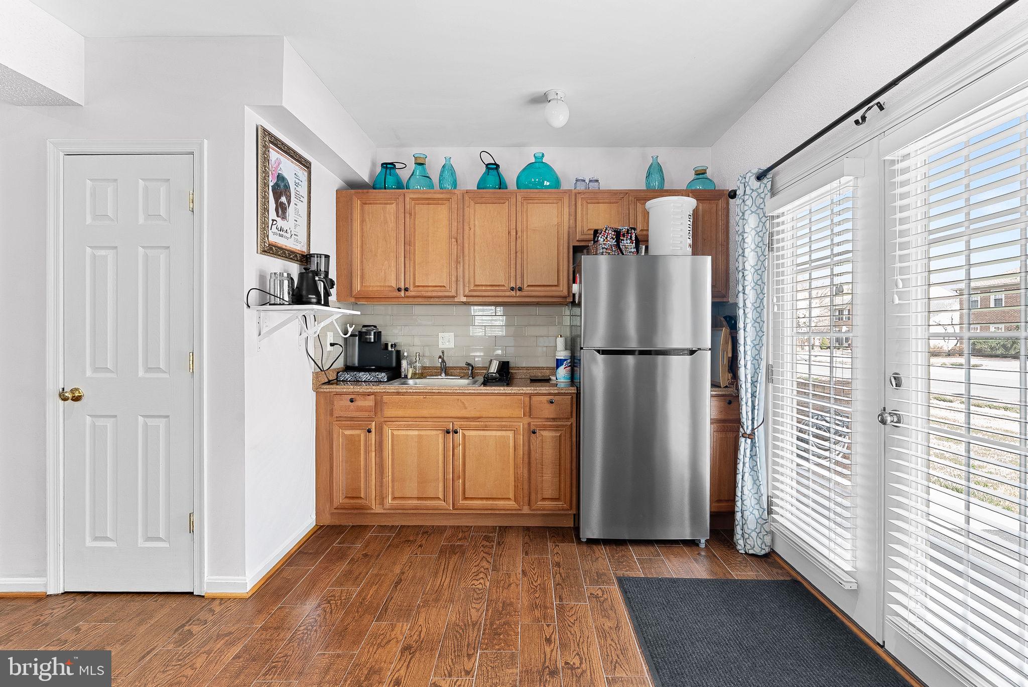 6208 Ormandy Drive Burke, VA 22015 - Photo 43 of 57 a kitchen with stainless steel appliances granite countertop a refrigerator and a stove top oven