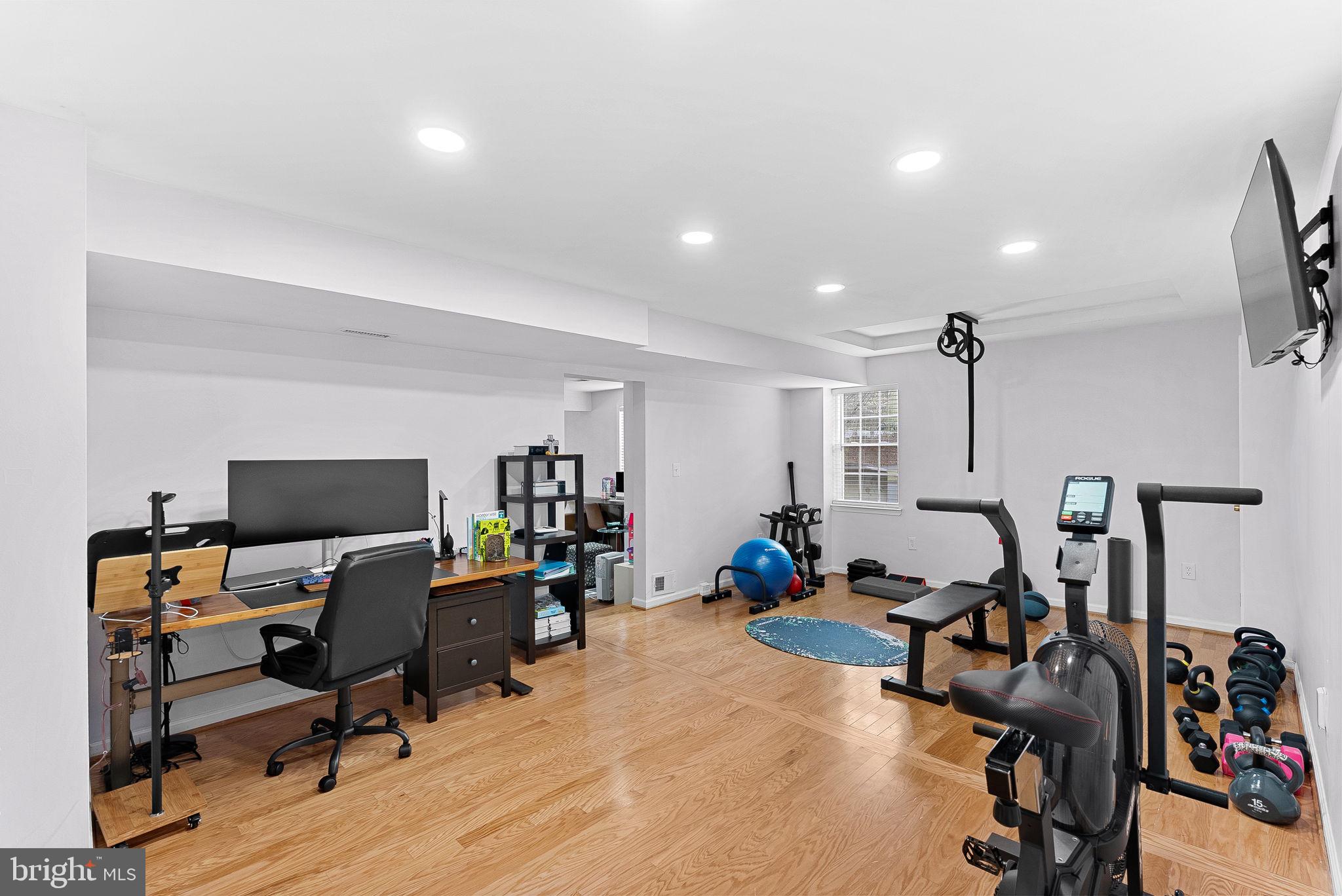 6208 Ormandy Drive Burke, VA 22015 - Photo 45 of 57 a view of a workspace with furniture and a gate