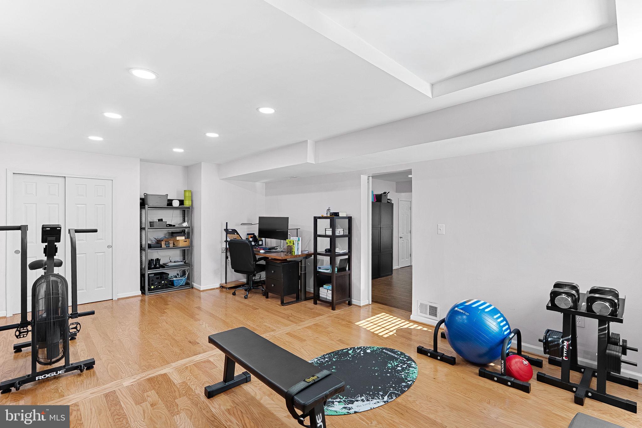 6208 Ormandy Drive Burke, VA 22015 - Photo 46 of 57 a bedroom with furniture and a gym equipment
