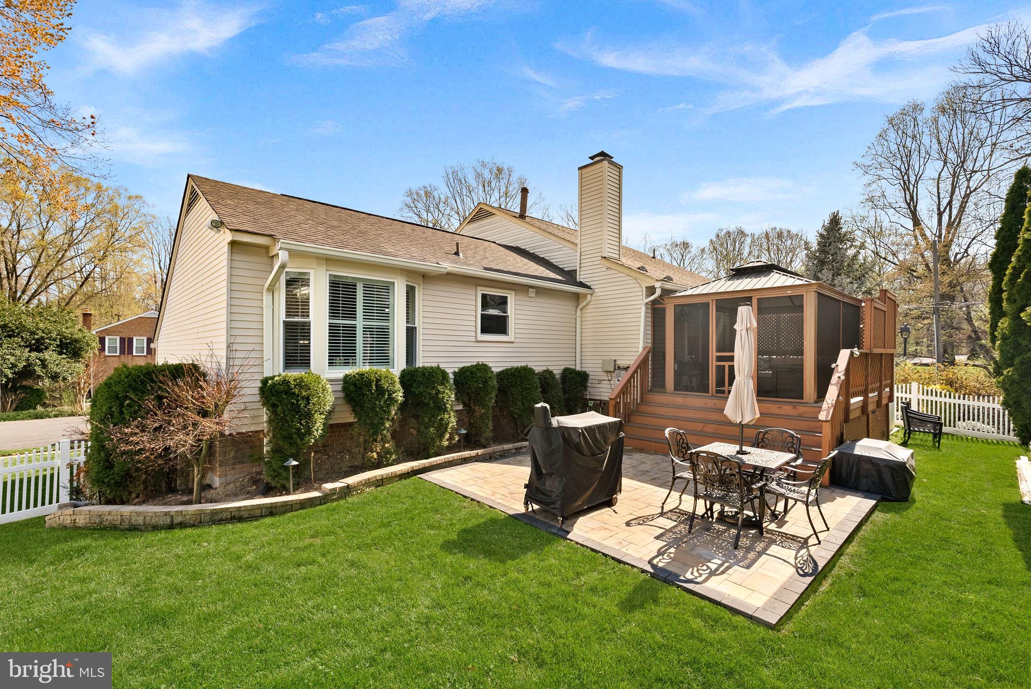 6208 Ormandy Drive Burke, VA 22015 - Photo 51 of 57 a view of a house with backyard sitting area and garden