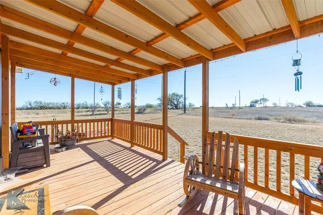 a view of balcony with wooden floor