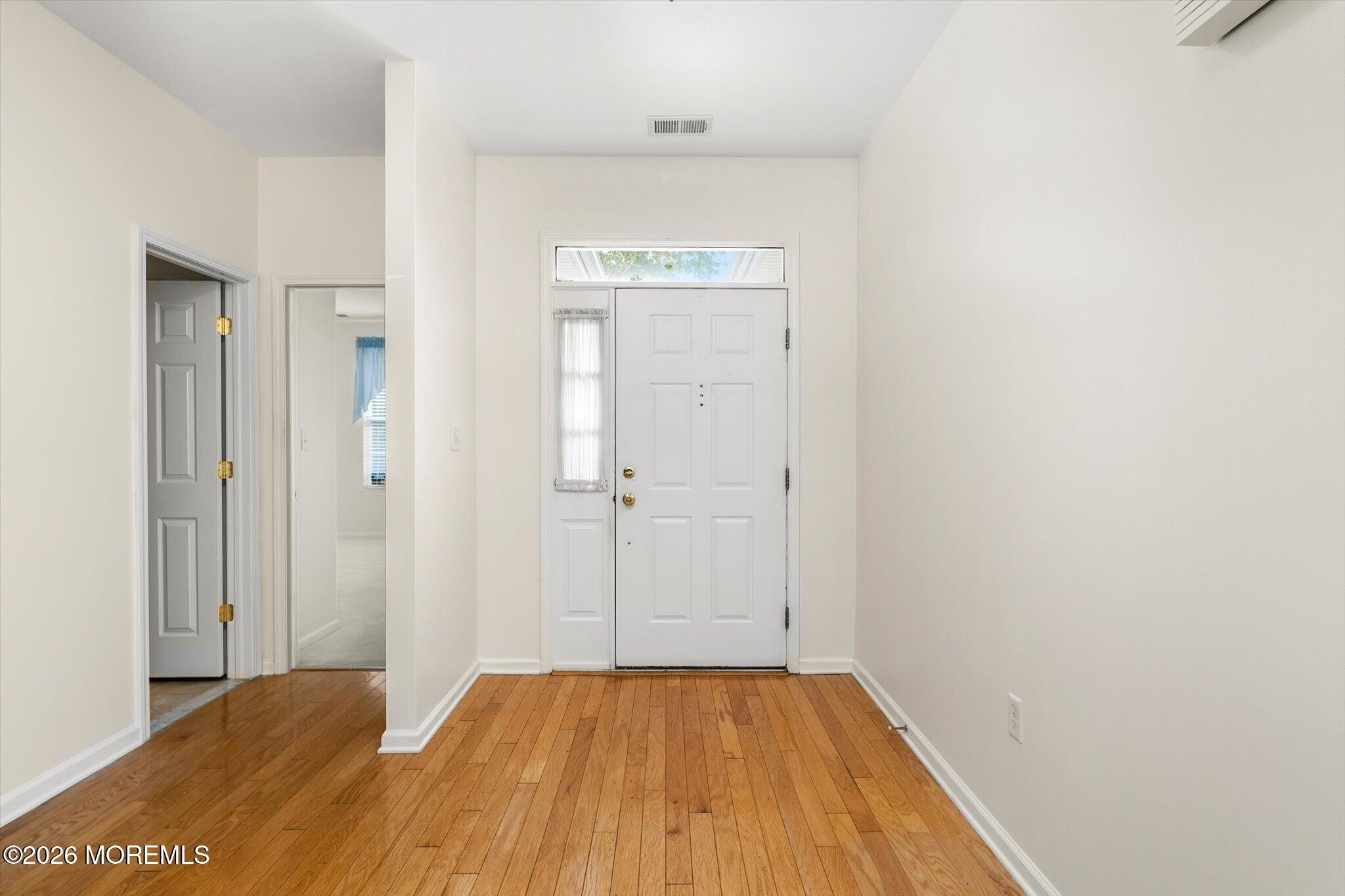 10 Powderhorn Way Allentown, NJ 08501 - Photo 2 of 27 a view of a hallway with wooden floor