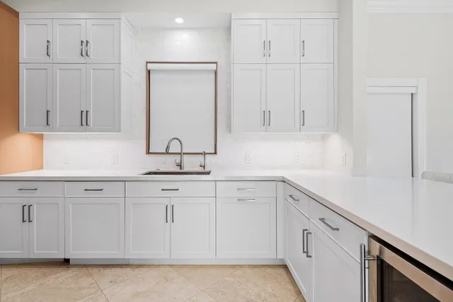 a view of a dining room with wooden floor and chandelier