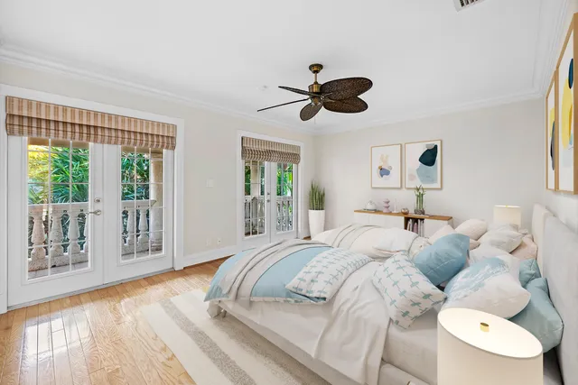 a bedroom with a large bed and a window