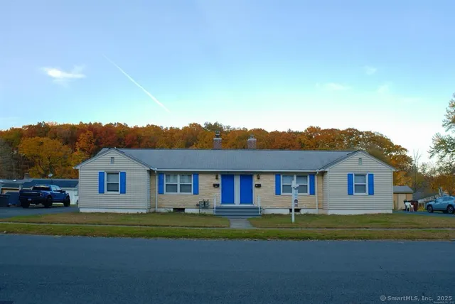 a front view of a house with a yard