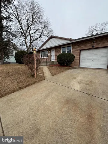 a front view of a house with parking