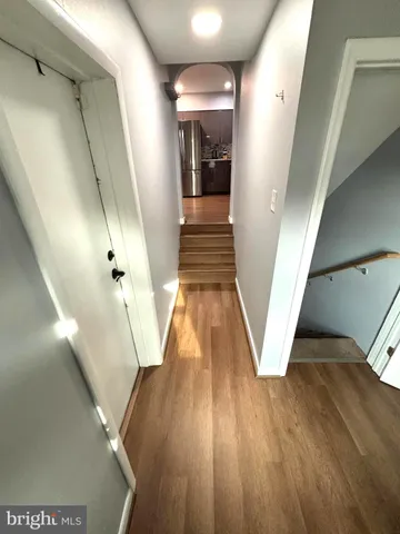 a view of a hallway view with wooden floor